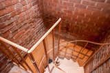 A spiral staircase leads to the basement utility room and laundry room. 