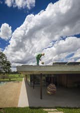 A staff worker tends to the grass roof. 