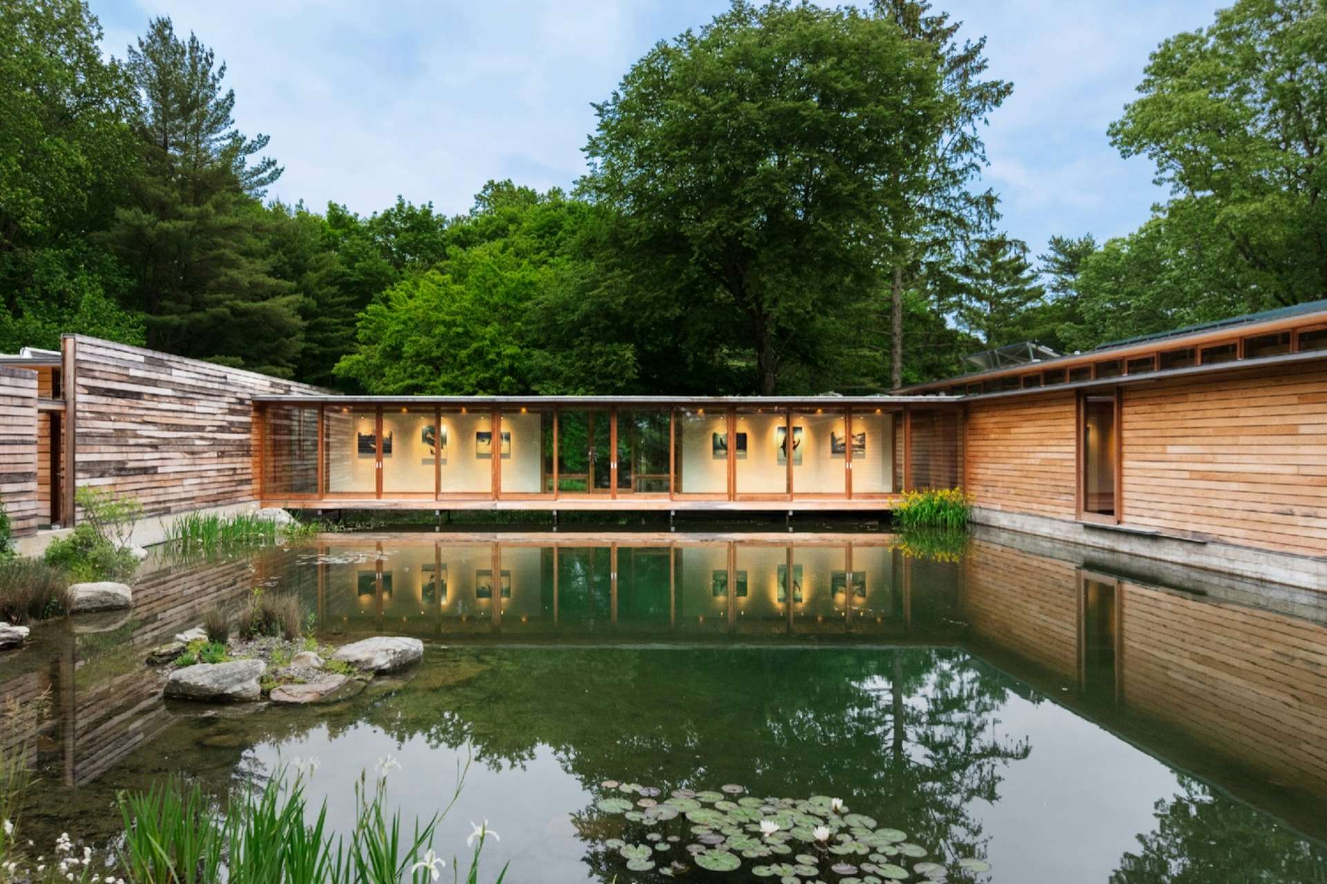 photo-5-of-17-in-this-striking-net-zero-home-wraps-around-a-serene-pond