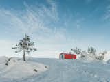 Exterior, Metal Siding Material, Gable RoofLine, Metal Roof Material, Prefab Building Type, Cabin Building Type, and Small Home Building Type The prefab cabin is a 40-minute hike from Kandalaksha.  Photo 7 of 22 in Go Off-Grid in Russia With This Bright Red Prefab Cabin