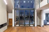 Doors, Metal, Folding Door Type, Exterior, and Swing Door Type Operable Luxal glazing opens up to a small terrace.  Photo 8 of 14 in A Shabby Attic Becomes a Chic, Cathedral-Style Living Space