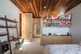 Kids, Porcelain Tile, Shelves, Girl, Bedroom, Storage, Desk, Bed, and Chair Here is a look at the room Gracia designed for his daughter, Valentina, which has ample storage for her toys.

  Kids Storage Shelves Chair Bedroom Photos from A Modern Mexican Home Rises With Vertical Timber Cladding