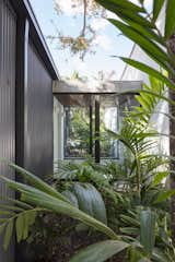 Gardens planted on both sides of the vestibule provide privacy, as well as an immersive jungle-like experience. 