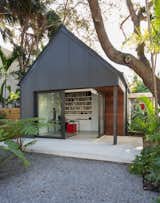 Exterior, House Building Type, Metal Roof Material, Metal Siding Material, and Gable RoofLine The gabled addition is topped with a standing seam metal roof and is clad in vertical corrugated metal siding.

  Photos from A Minimalist Bungalow in Miami Welcomes a Sleek New Addition