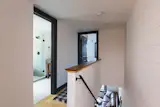 White shiplap continues from the first floor to the second, which houses the two bedrooms.

