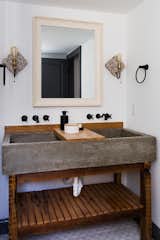 Bath, Ceramic Tile, Vessel, Wood, Wall, and Wall Mount The double vanity in the master bath has a concrete trough sink with a wood slab counter.

  Bath Wall Ceramic Tile Vessel Wood Photos from Before & After: A Dark 1880s Row Home Gets an Airy Makeover