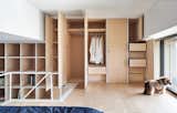 The minimalist built-in storage units draw inspiration from the Japanese brand MUJI.