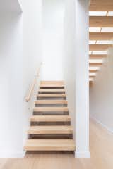 Staircase, Wood Tread, and Wood Railing Open-riser stairs lead up to the master suite.  Photo 8 of 18 in A Melbourne Home Gains a Marvelous Modular Addition