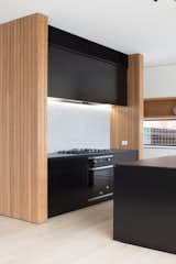 The kitchen is fitted with a Highland ceramic glass cooktop and a built-in oven.


