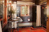 Each of the bathrooms features a soaking tub and different patterned tile.  Photo 19 of 23 in Frank Lloyd Wright’s Iconic Ennis House Is Listed For $23M