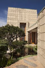 Exterior, House Building Type, and Concrete Siding Material A small koi pond and broad terrace can be found on the north side.   Photo 9 of 23 in Frank Lloyd Wright’s Iconic Ennis House Is Listed For $23M