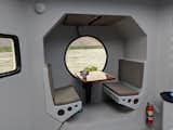 Dining Room, Ceiling Lighting, Table, and Bench A look at the breakfast nook. The Lunar Lander can comfortably entertain up to four people.   Photo 7 of 17 in A Lunar Lander-Inspired Tiny House is an Otherworldly Escape