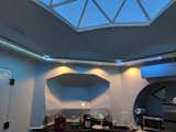 LED strip lighting and recessed ceiling lights illuminate the space at night. 