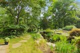 The property also includes a landscaped koi pond with ornamentals. 