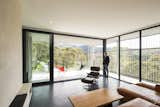 The light-filled living area features Bluestone paving and polished plaster walls. 