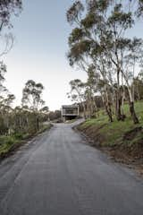 Exterior, Metal Roof Material, Metal Siding Material, Flat RoofLine, and House Building Type Nestled into the side of Mount Macedon, the home is on a remote site surrounded by nature, yet still within a commutable drive to Melbourne.  Photos from A Fire-Resistant House Cuts a Striking Figure in the Australian Bush