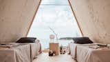A quick 20-minute boat ride from Helsinki, this cliffside A-frame can be rented for $35 a night. Designed to have a minimal footprint, the plywood-clad Nolla Cabin has a triangular polycarbonate window overlooking the water and is simply yet comfortably furnished. 