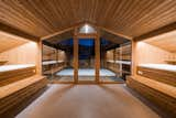 Bedroom, Bed, Recessed Lighting, Concrete Floor, and Storage New high-performance glazing lets in plenty of light and landscape views without compromising energy efficiency. The windows are framed in larch on the interior and in dark steel on the exterior.

  Photos from A 1970s UFO House Gains a Glorious Renovation