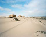 Shipwreck Lodge is located near the dry mouth of the Hoarusib River amidst a landscape of windswept sand dunes and salt-tolerant plants. 