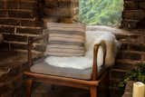 Living Room and Chair Soft textiles help turn the brick-and-stone structure into a more inviting space.   Photo 10 of 14 in Airbnb Cancels the Great Wall of China Contest