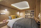 One of the most effective bedroom lighting ideas for a low ceiling is this recessed skylight-inspired lighting feature. It helps keep the space from feeling too snug.