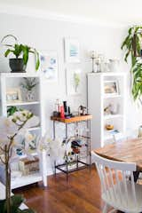 "I painted these bookcases white to brighten up the space, but then nothing else matched them," says Janelle. "So naturally, everything else in the room had to go so that the bookcases could work. So pretty much this room was built around white paint."