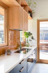 The compact 54-square-foot kitchen is equipped with an induction cooktop (no gas used). The countertops are Create Stone's White Quartz made with 72 percent post-industrial waste. 