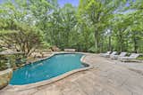 Outdoor, Back Yard, Trees, Grass, Stone, Large, Large, and Swimming The pools were added in the 1980s by the current seller.   Outdoor Trees Large Stone Swimming Grass Photos from Jackie Gleason’s Spaceship-Like Mansion Hits the Market For $12M