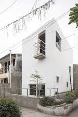 Jakarta and Bandung–based architecture studio&nbsp;dua worked within a 602-square-foot plot—and a budget of approximately $20,000—to renovate the 4x6x6 House for a young family in Bandung, Indonesia. The house stands out with its boxy white form but still adheres to the neighborhood's two-story height norm. Operable windows of varying sizes give the building a sculptural appearance while also helping to let cooling breezes into the home.