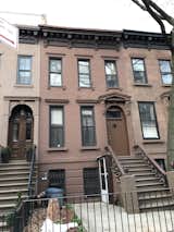 The Brownstone's former exterior blended in with its neighbors and required restoration and repairs.