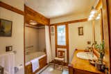 Bath Room, Alcove Tub, Wall Lighting, Drop In Sink, Ceiling Lighting, and Wood Counter A peek inside the master bathroom with custom built-ins.   Photo 12 of 15 in Snatch Up This Rare Frank Lloyd Wright-Designed ASB Home For $777K