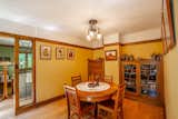This small dining room was originally the kitchen. The built-in hutch with the leaded-glass windows is an original feature.

  Photo 6 of 15 in Snatch Up This Rare Frank Lloyd Wright-Designed ASB Home For $777K
