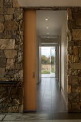 Hallway and Porcelain Tile Floor Floor Gres Architech porcelain floor tiles (in Ash Gray) line the entry and lower level corridor.

  Photos from An Uplifting Family Retreat Boasts Breathtaking Views of the Tetons