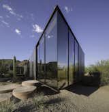 Full-height glazing mainly wraps around the west and south sides of the structure to frame views of Camelback Mountain. 