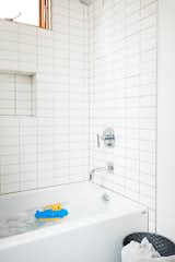 Cost-effective subway tile has been used in the kids' bathrooms.