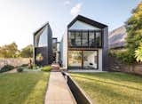Exterior, Metal Roof Material, House Building Type, and Metal Siding Material Designed to mimic a natural gorge, the Iron Maiden House features rock-like building volumes bisected with river-like water features.  TC’s Saves from Water Slices Through This Gorge-Inspired Australian House