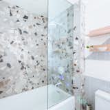 Bath, Soaking, Wall, Enclosed, Ceramic Tile, Alcove, and Two Piece The shower surround tile is I COCCI by Fioranese Ceramica sourced through Olympia Tile/Beaver Tile.  Bath Soaking Ceramic Tile Wall Photos from Budget Breakdown: A Humdrum Bathroom Gets a Retro-Chic Facelift For $17K