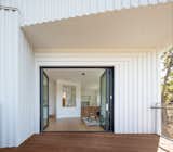 Doors, Folding Door Type, Exterior, and Metal Folding aluminum-framed glass doors facilitate a seamless transition between indoors and out.

  Photos from Stacked Boxes Form an Experimental Hillside House