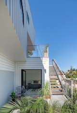 Doors, Swing Door Type, Exterior, and Metal Built into a steep slope, this contemporary spec house hopes to raise the bar for hillside development in Los Angeles. The lower-level ADU can be used as an office, fourth bedroom, guest room for Grandma and Grandpa, or a suite for a possible tenant.  Photo 6 of 16 in Stacked Boxes Form an Experimental Hillside House