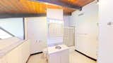 A look inside the adjoining bathroom, approximately 100 square feet in size. 