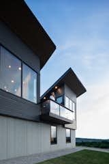 Exterior, Metal Siding Material, Concrete Siding Material, House Building Type, Metal Roof Material, Wood Siding Material, and Shed RoofLine The deck projects out toward the beach.  Photos from A Folded Steel Roof Shields a Fortress-Like Abode in Nova Scotia