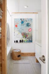 Christine created the ‘Abstract No. 10, The Heavens Are Weeping’ artwork hanging in the upstairs bathroom. Both bathrooms in the property feature heated ceramic floors. 