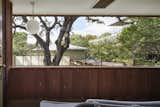 The second-floor balcony on the west side overlooks views of the majestic live oak.