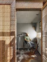 Office, Chair, Concrete, Rug, and Study The hunting blind is a small and square room, furnished with a cowhide rug, two guest chairs, and a hunting bar.

  Office Rug Chair Concrete Photos from An Award-Winning Writing Studio Hides Quietly in Texas