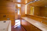 Bath Room, Alcove Tub, Concrete Floor, Undermount Sink, and Wall Lighting The master bath includes a double vanity as well as a jacuzzi tub with rain shower.  Photo 7 of 12 in New Jersey’s Oldest and Largest Frank Lloyd Wright House Cuts Price to $1.45M