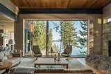 Living, Wall, Sofa, End Tables, Chair, Coffee Tables, Table, Recessed, Medium Hardwood, and Wood Burning The massive, thermally broken steel windows were installed by crane.

  Living Table Wall Wood Burning Photos from This Modern Cliff House Seamlessly Knits Into a Rocky Idaho Lakefront