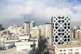 Wrapped in an energy-efficient, double-skin facade of glass and composite aluminum panels, this 12-story office tower in Tehran features a pattern referencing the motif a mandala. 