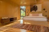 Bedroom, Bed, Wall Lighting, Recessed Lighting, Storage, and Light Hardwood Floor The light-filled bedroom comes with a cozy king-size bed, as well as air conditioning and heating.

  Photo 9 of 15 in Escape to the Texan Treetops in This Eco-Luxe Treehouse