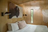 Bedroom, Bed, and Wall Lighting The walls are FSC-certified birch plywood. The floors are FSC-certified hardwood maple.   Photo 10 of 15 in Escape to the Texan Treetops in This Eco-Luxe Treehouse