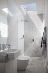 The light-filled ensuite bathroom includes a Nickles showerhead and MIZU taps. 